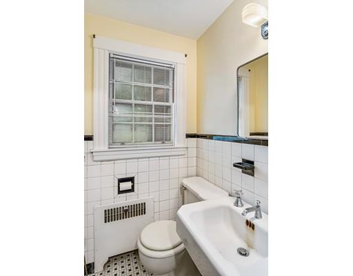 95 Leland Road Boston, MA 02467 - Photo 9 of 20 a bathroom with a sink toilet and mirror