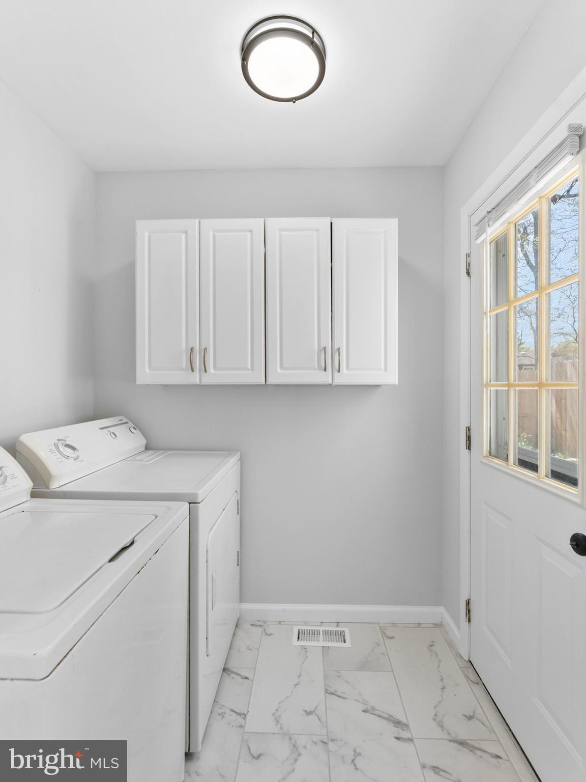 23 Roxborough Place Willingboro, NJ 08046 - Photo 11 of 23 a utility room with dryer and washer