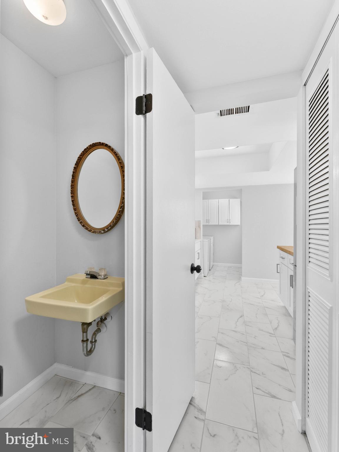 23 Roxborough Place Willingboro, NJ 08046 - Photo 12 of 23 a bathroom with a sink a toilet and a mirror