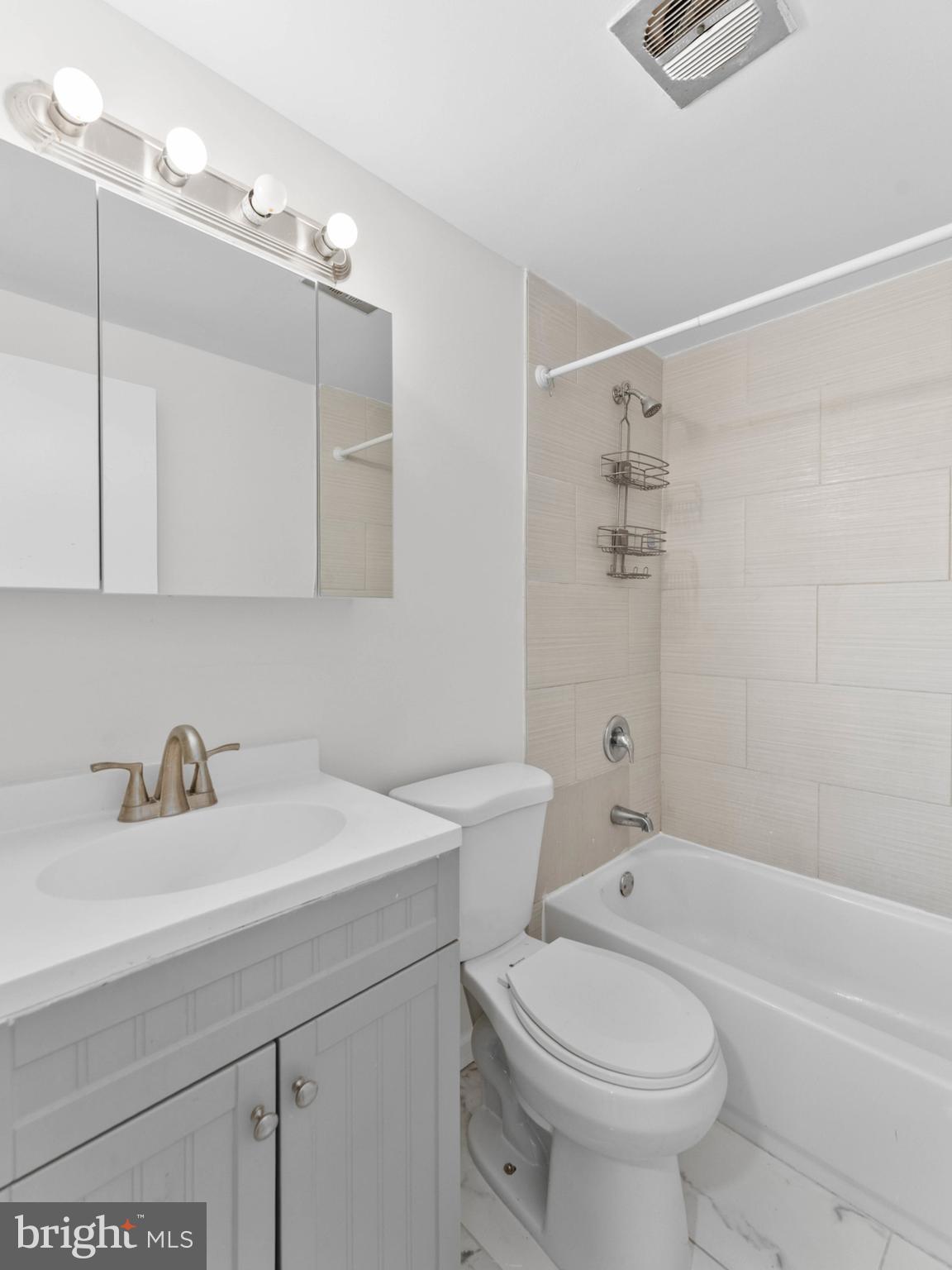 23 Roxborough Place Willingboro, NJ 08046 - Photo 13 of 23 a bathroom with a sink a toilet and bathtub