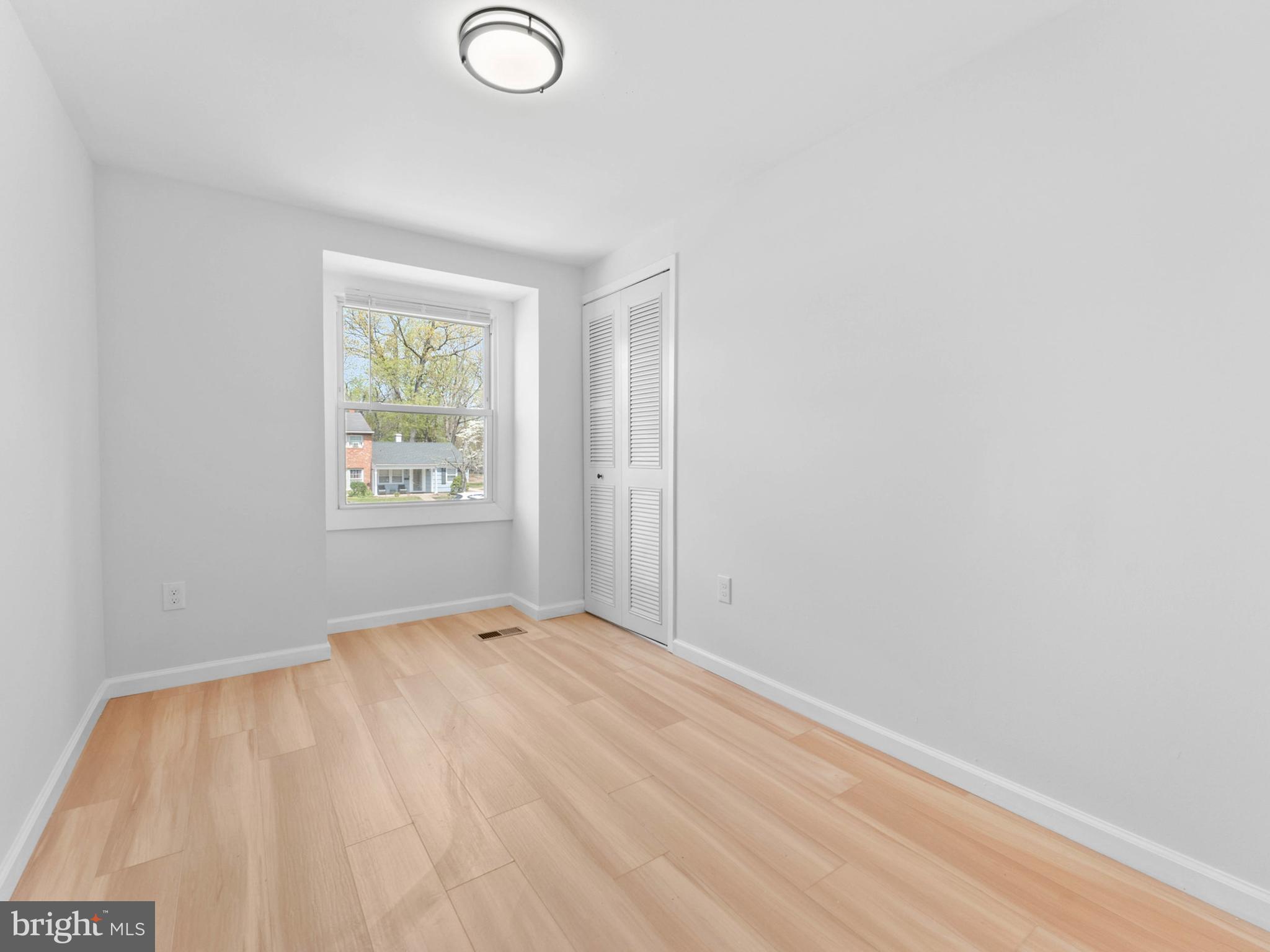 23 Roxborough Place Willingboro, NJ 08046 - Photo 17 of 23 a view of empty room with window and wooden floor