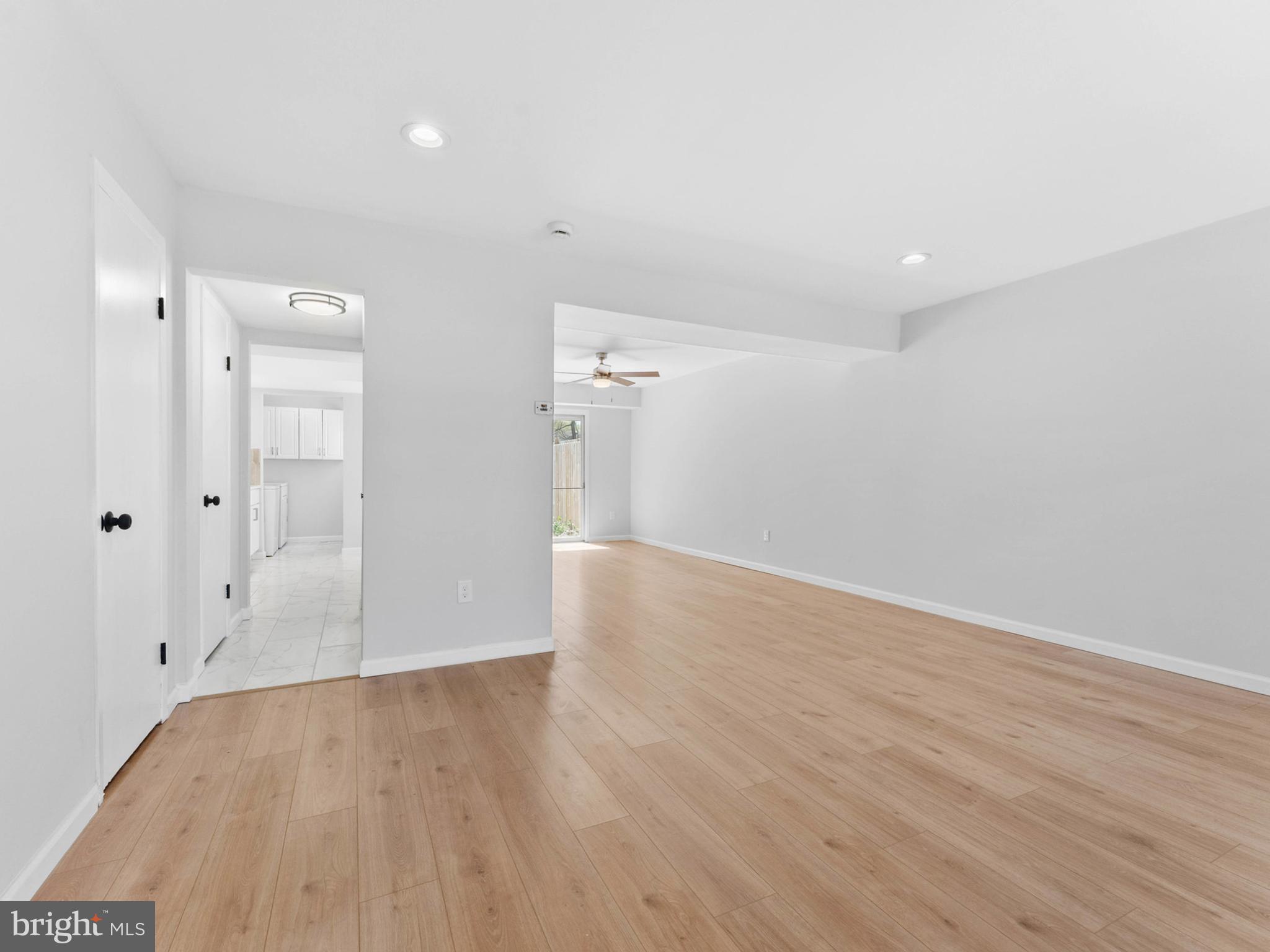 23 Roxborough Place Willingboro, NJ 08046 - Photo 2 of 23 wooden floor in an empty room with a window