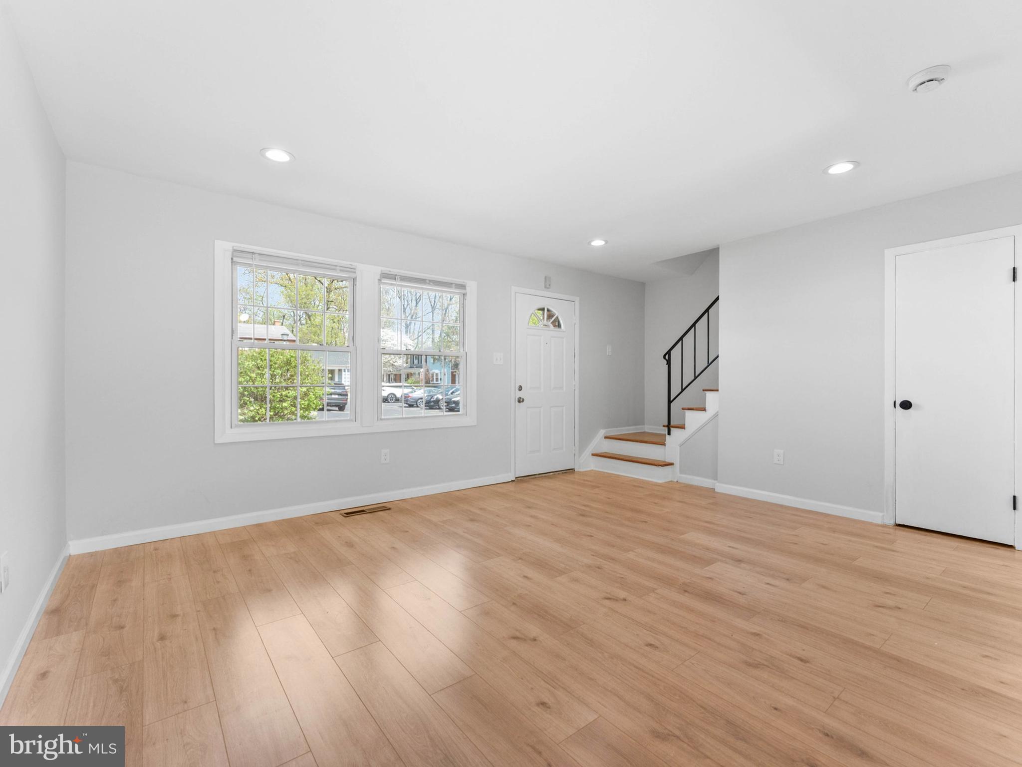 23 Roxborough Place Willingboro, NJ 08046 - Photo 5 of 23 a view of an empty room with wooden floor and a window