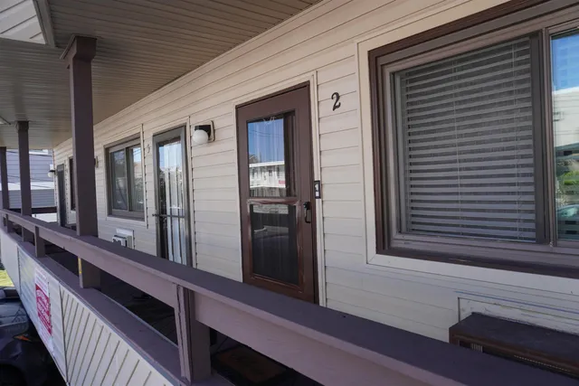 a view of a balcony with chairs