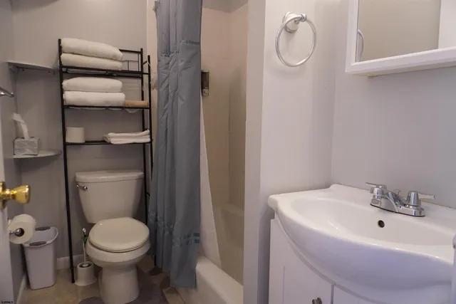 a bathroom with a sink and toilet
