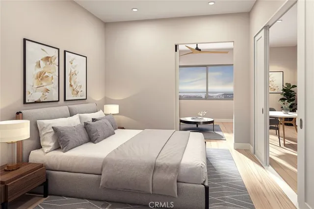 a bedroom with a bed and a painting on the wall