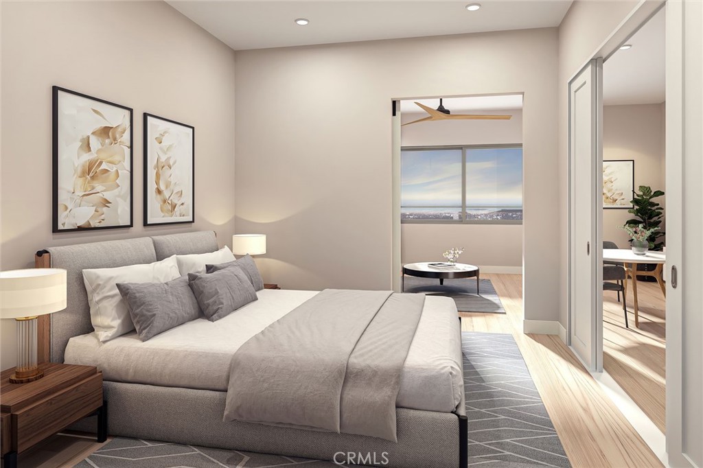 a bedroom with a bed and a painting on the wall