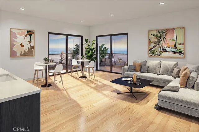 a living room with furniture hard wood floor and a floor to ceiling window