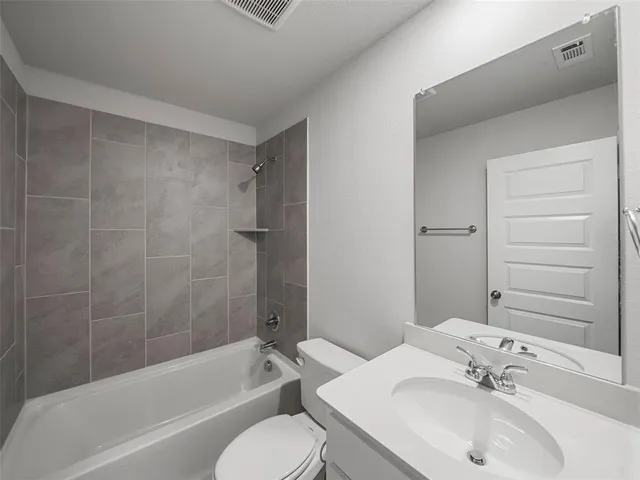 a bathroom with a sink toilet and bathtub