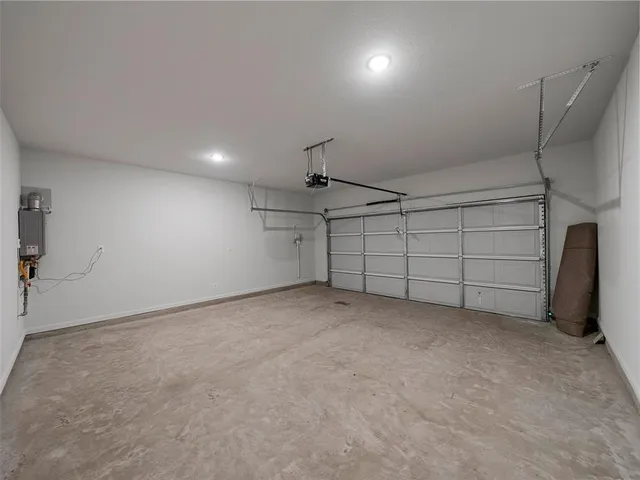 a view of house with backyard and sitting area