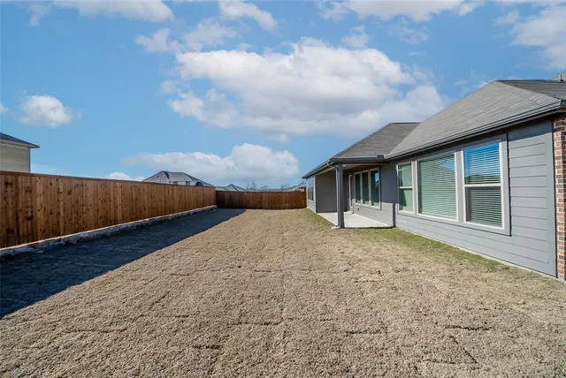 an aerial view of a house with a swimming pool