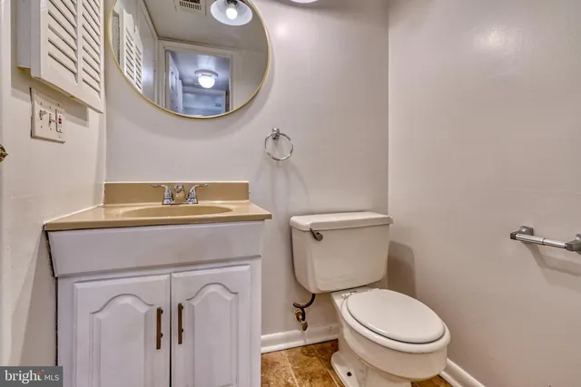a bathroom with a toilet and a sink
