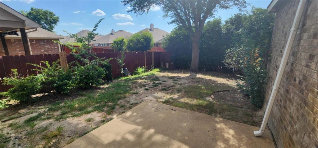 4204 Talbot Lane McKinney, TX 75070 - Photo 13 of 13 a backyard of a house with lots of green space