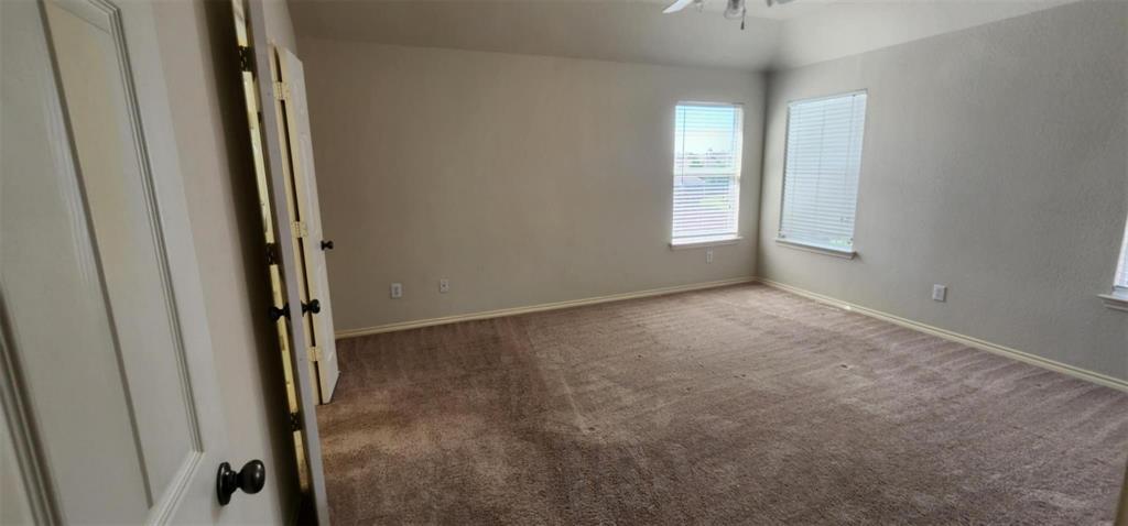 4204 Talbot Lane McKinney, TX 75070 - Photo 7 of 13 an empty room with windows and closet