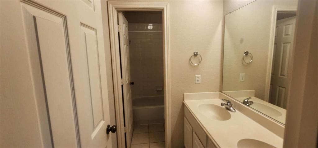 4204 Talbot Lane McKinney, TX 75070 - Photo 8 of 13 a bathroom with a sink vanity granite tub and shower