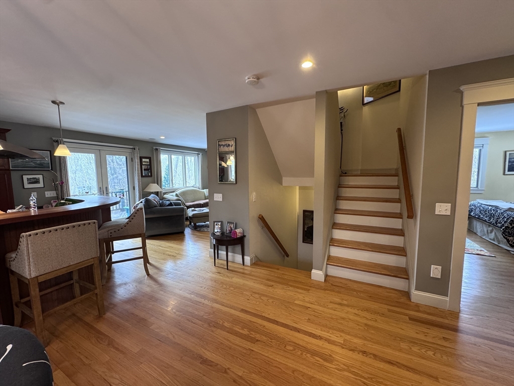 127 Preservation Way Tiverton, RI 02878 - Photo 17 of 41 a living room with furniture and a wooden floor