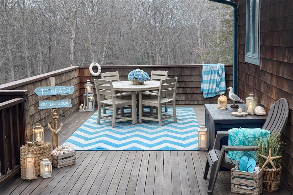 127 Preservation Way Tiverton, RI 02878 - Photo 23 of 41 a view of deck with table and chairs barbeque with wooden floor