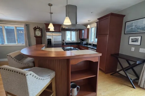 a dining room with furniture and window