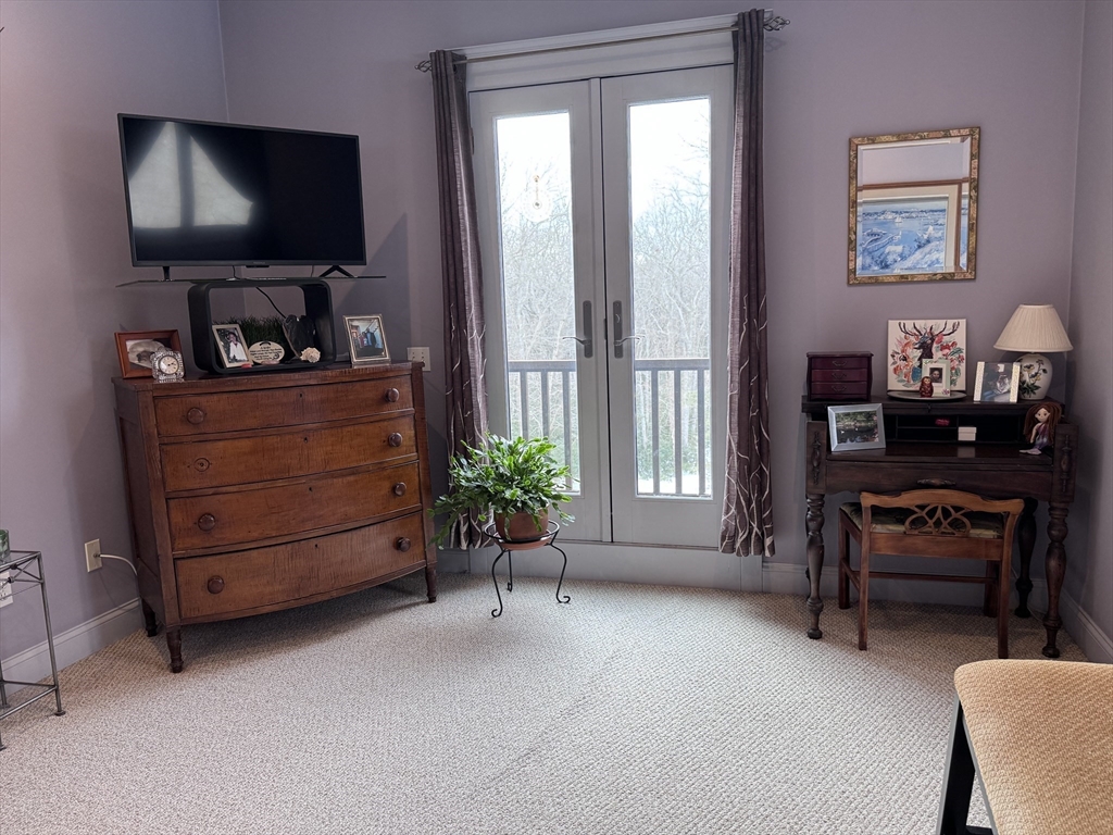 127 Preservation Way Tiverton, RI 02878 - Photo 31 of 41 a living room with furniture and a flat screen tv