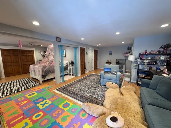 a living room with furniture and a rug
