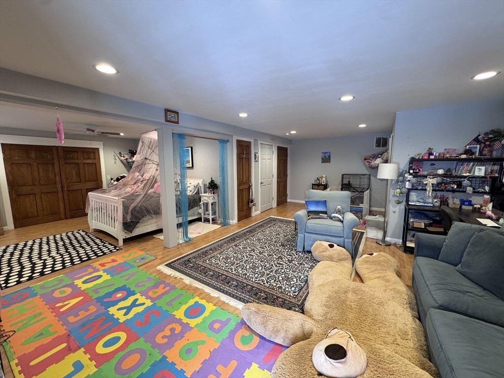 127 Preservation Way Tiverton, RI 02878 - Photo 36 of 41 a living room with furniture and a rug