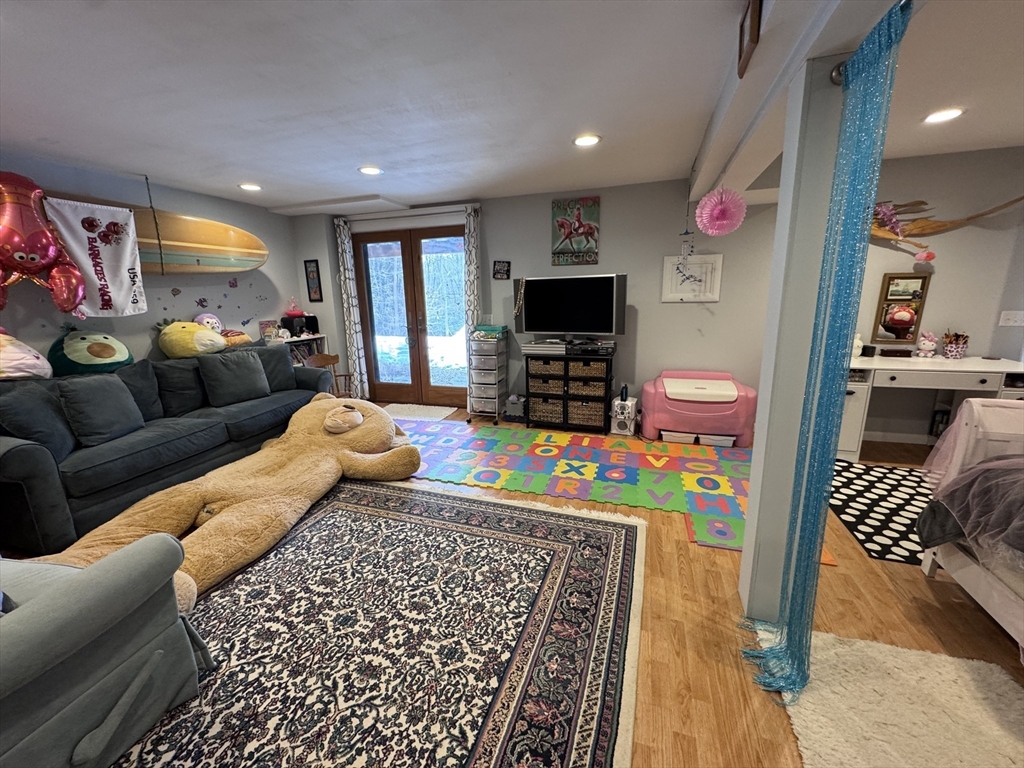 127 Preservation Way Tiverton, RI 02878 - Photo 38 of 41 a living room with furniture and a flat screen tv