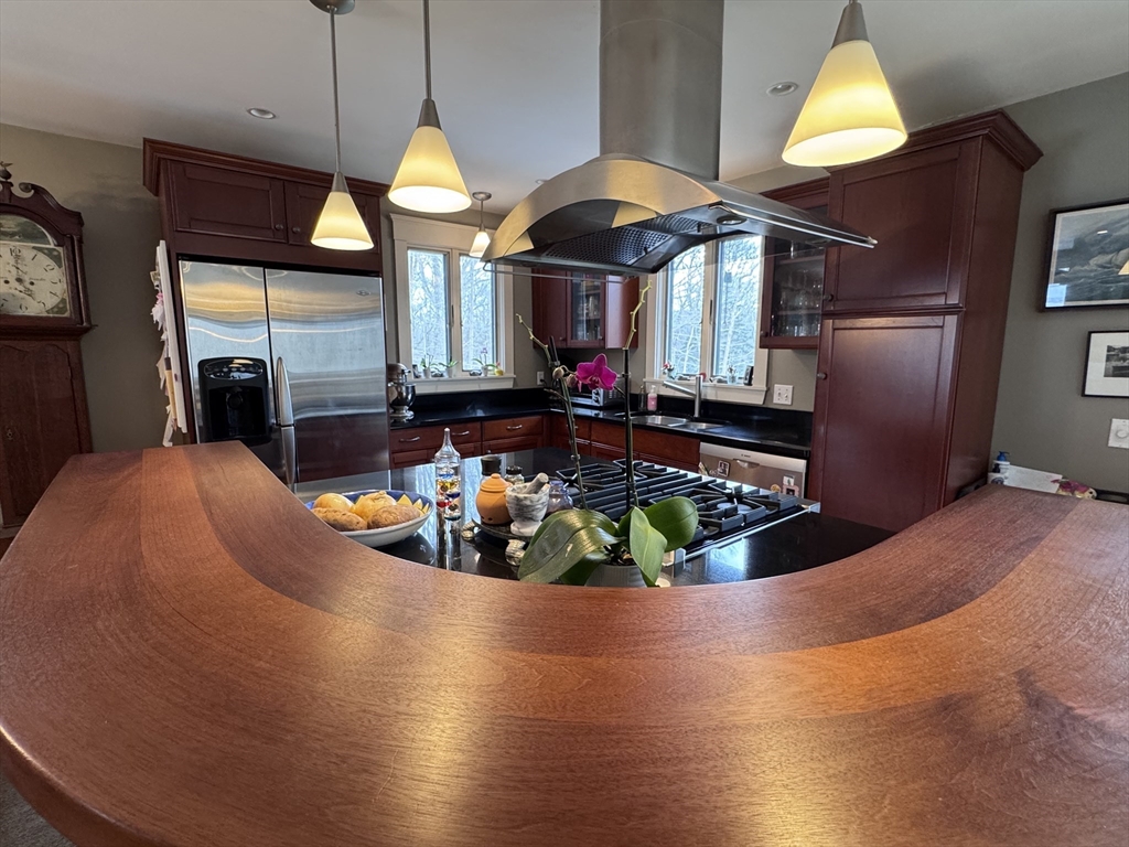127 Preservation Way Tiverton, RI 02878 - Photo 5 of 41 a view of a living room with kitchen island furniture and a chandelier
