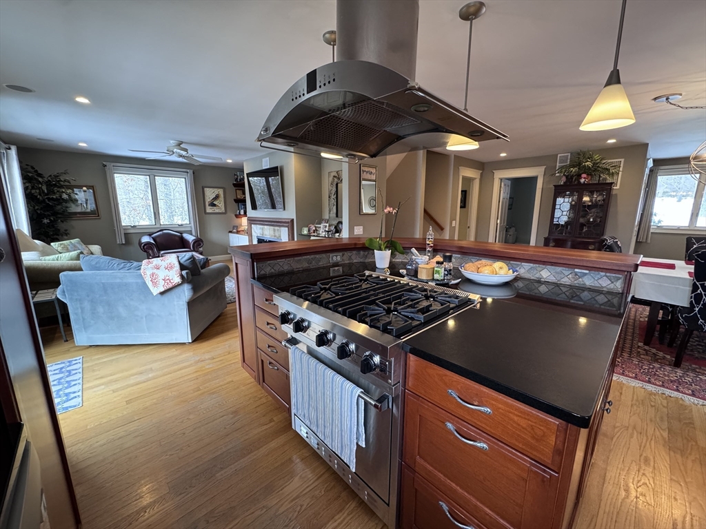 127 Preservation Way Tiverton, RI 02878 - Photo 7 of 41 a kitchen with a stove and a wooden floors