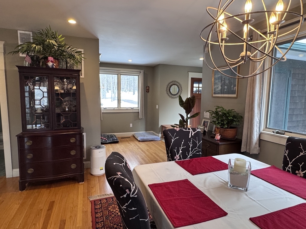 127 Preservation Way Tiverton, RI 02878 - Photo 8 of 41 a bedroom with furniture and wooden floor