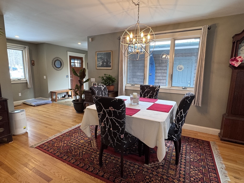 127 Preservation Way Tiverton, RI 02878 - Photo 9 of 41 a living room with furniture and a chandelier