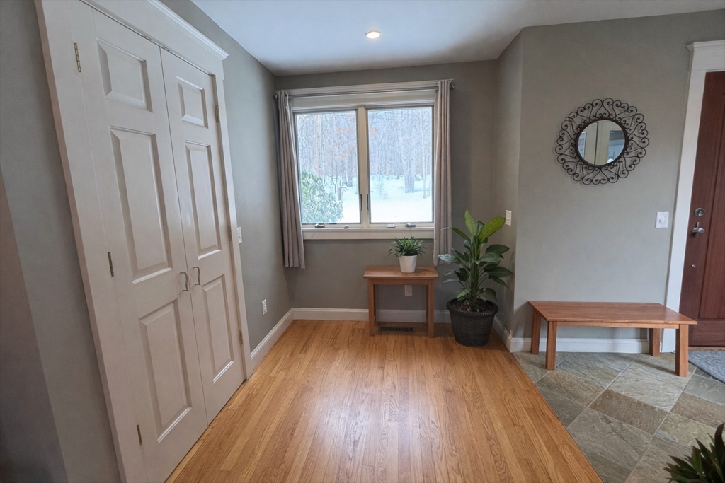 127 Preservation Way Tiverton, RI 02878 - Photo 10 of 41 a view of a room with wooden floor and a window