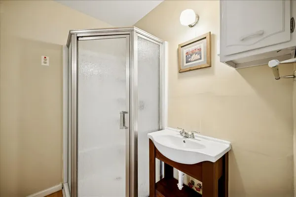 a bathroom with a sink and a mirror