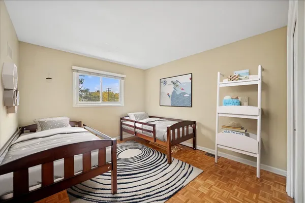 a bedroom with furniture and a window