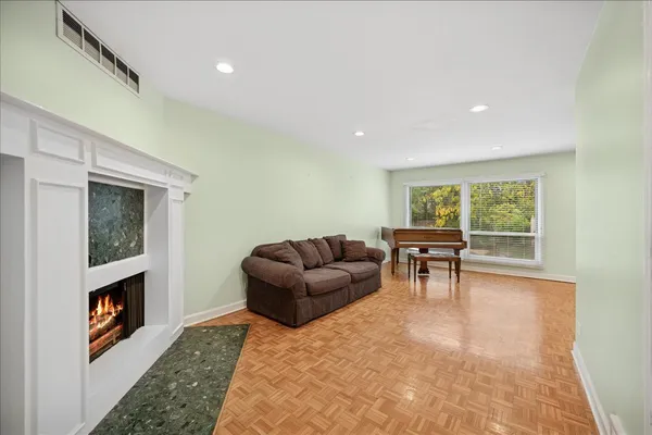 a living room with furniture and a fireplace