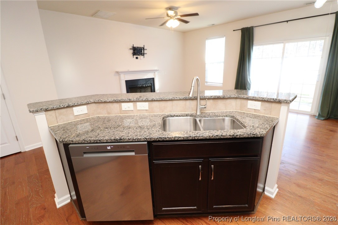 1712 Grace Point Road Morrisville, NC 27560 - Photo 13 of 35 a kitchen with a sink and a refrigerator