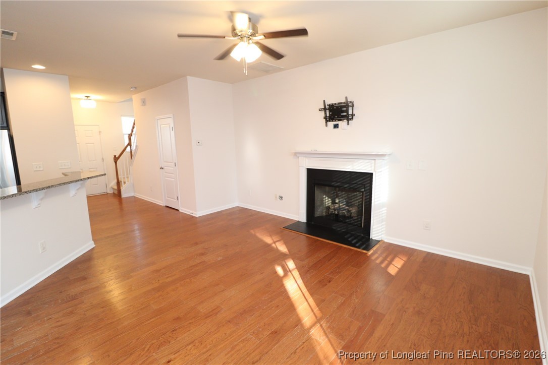 1712 Grace Point Road Morrisville, NC 27560 - Photo 17 of 35 a view of an empty room and chandelier fan