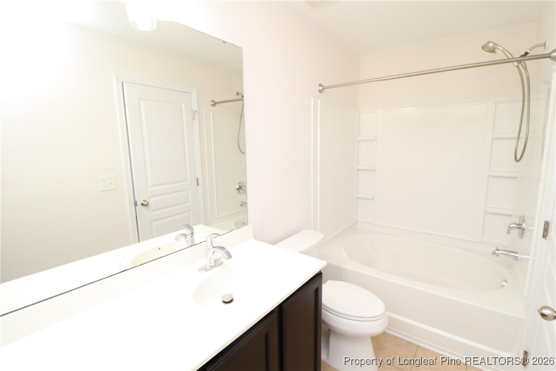 1712 Grace Point Road Morrisville, NC 27560 - Photo 30 of 35 a bathroom with a sink a toilet and shower