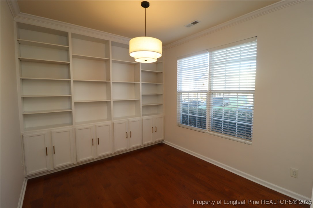 1712 Grace Point Road Morrisville, NC 27560 - Photo 8 of 35 a view of an empty room with a window and chandelier