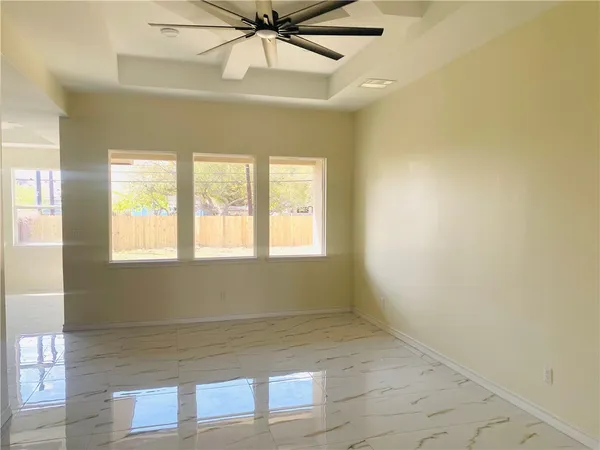 a view of an empty room with a window