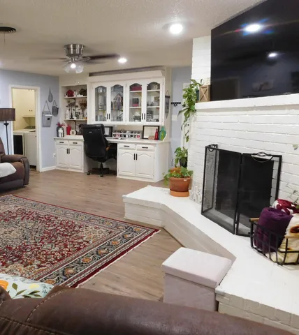 a living room with furniture and a fireplace