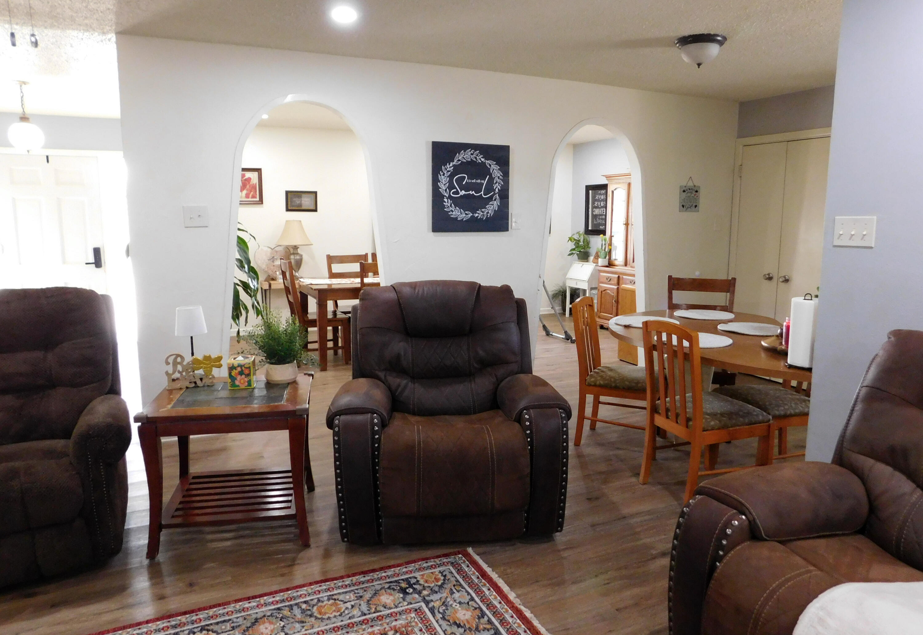 1730 West Ave F Muleshoe, TX 79347 - Photo 13 of 32 a living room with furniture and wooden floor