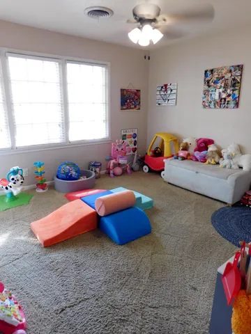 a living room with furniture and a table