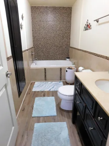 a bathroom with a sink vanity and mirror