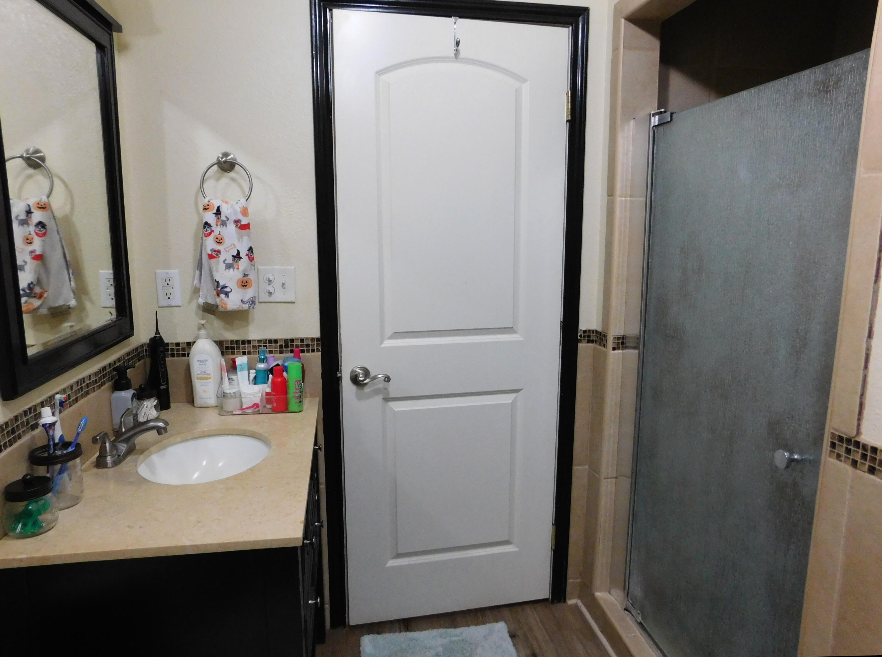 1730 West Ave F Muleshoe, TX 79347 - Photo 26 of 32 a bathroom with a sink vanity and mirror