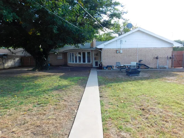 a backyard of a house with seating space