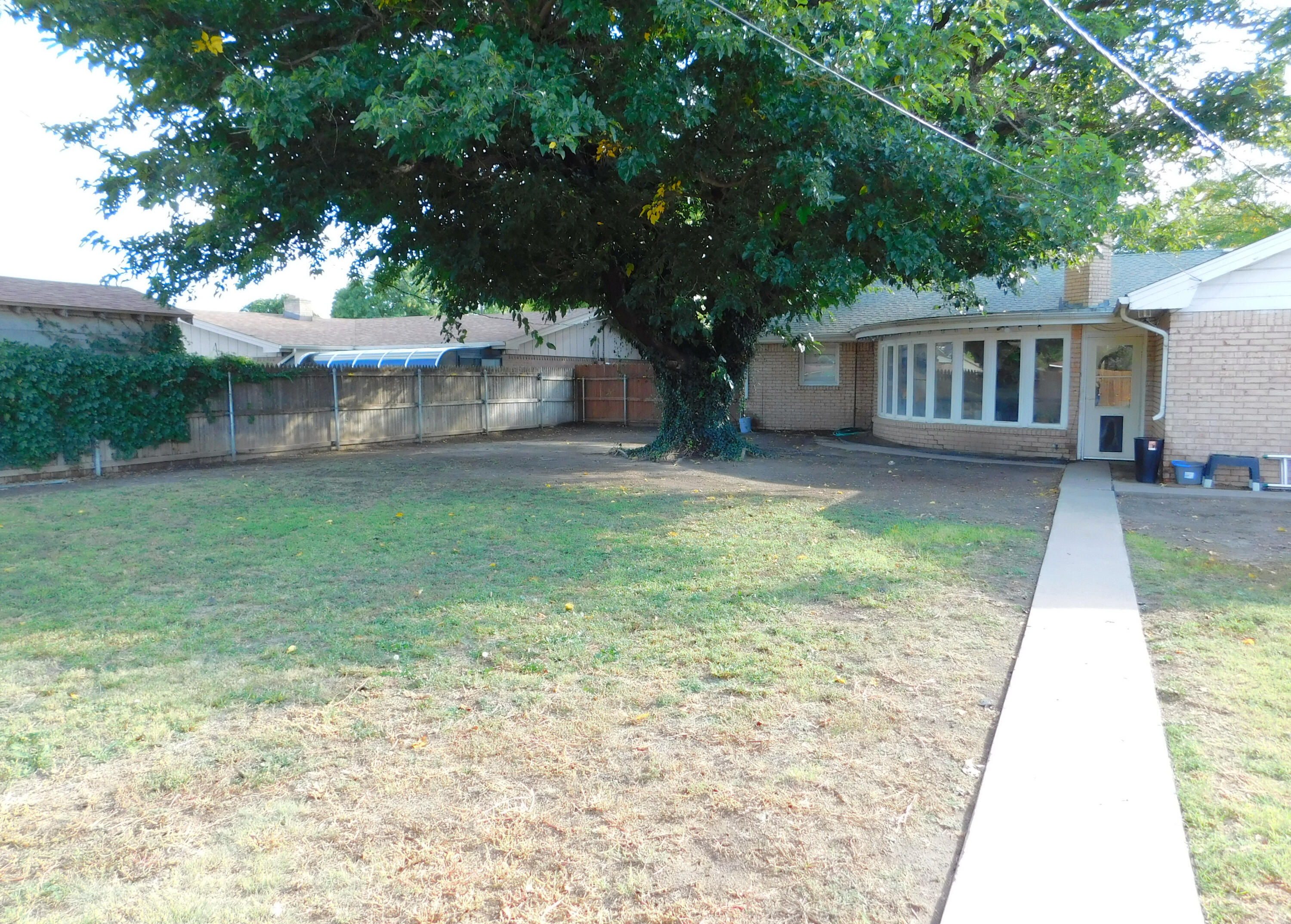 1730 West Ave F Muleshoe, TX 79347 - Photo 28 of 32 a backyard of a house with seating space