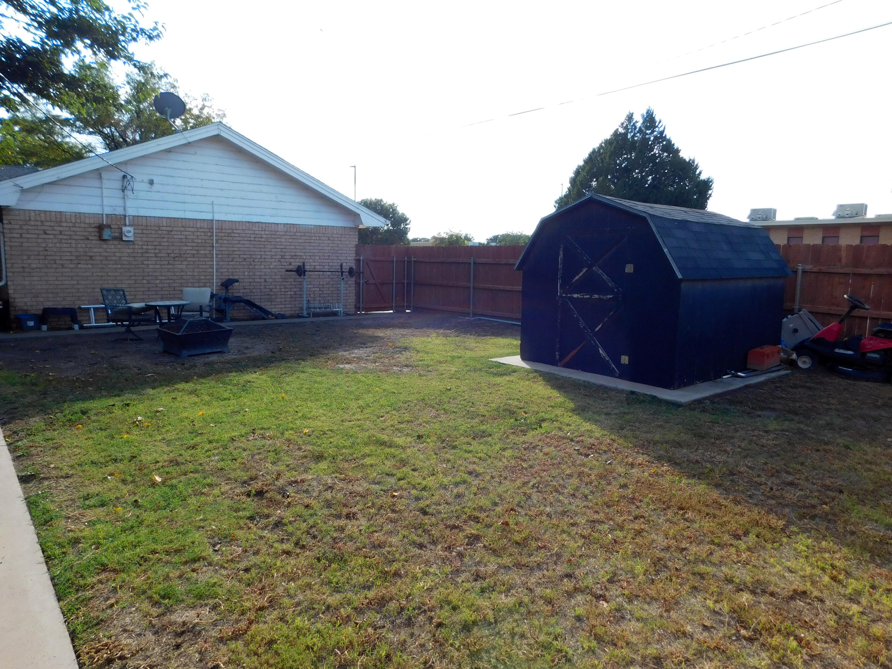 1730 West Ave F Muleshoe, TX 79347 - Photo 29 of 32 a view of a backyard with plants and a patio