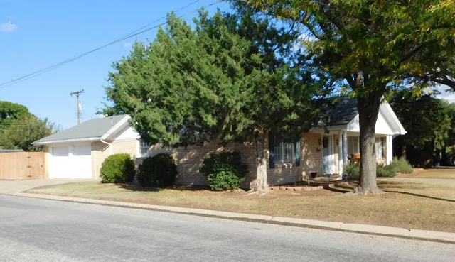 a view of a house with a street