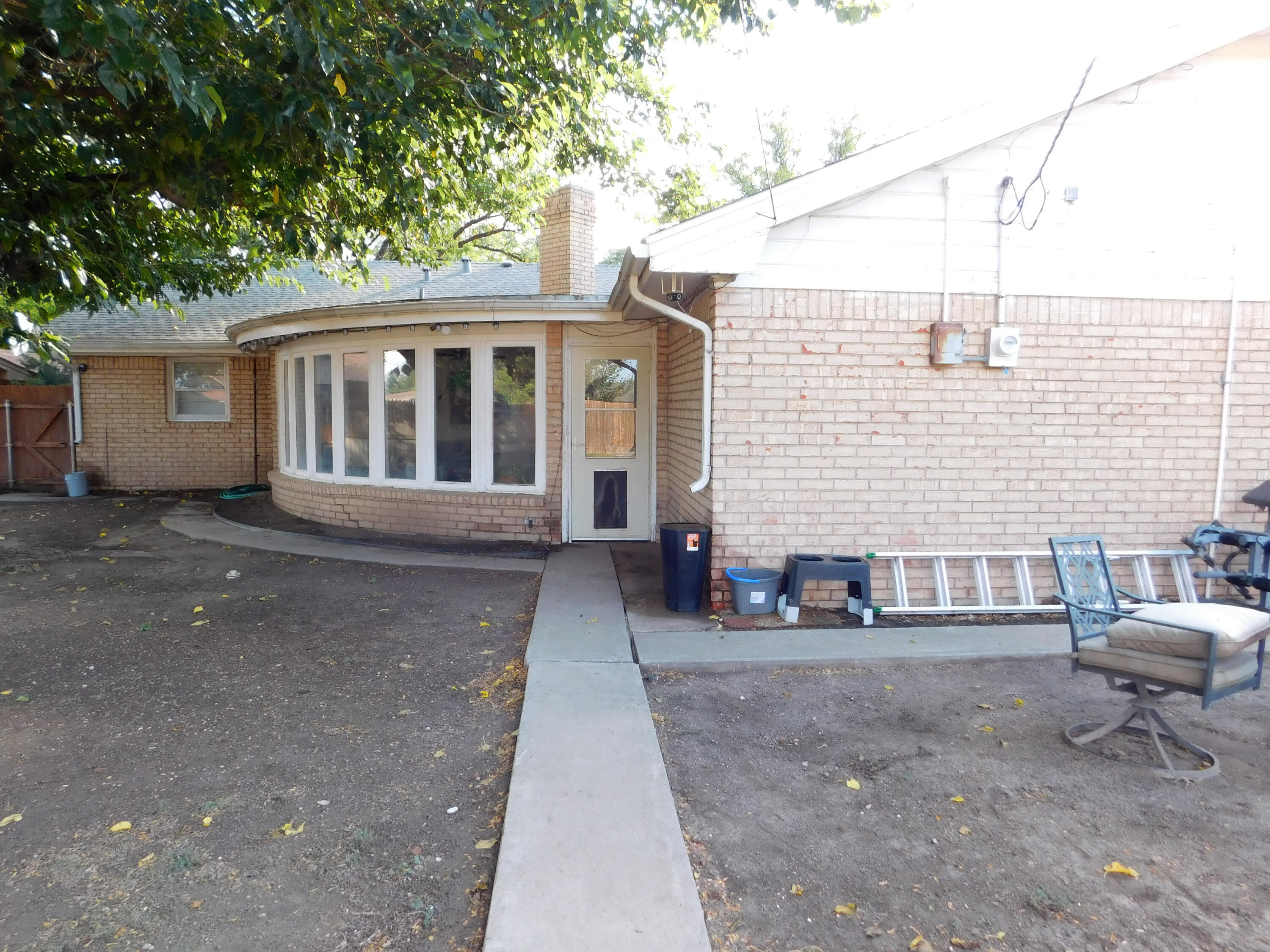 1730 West Ave F Muleshoe, TX 79347 - Photo 31 of 32 a view of a house with a yard and sitting area
