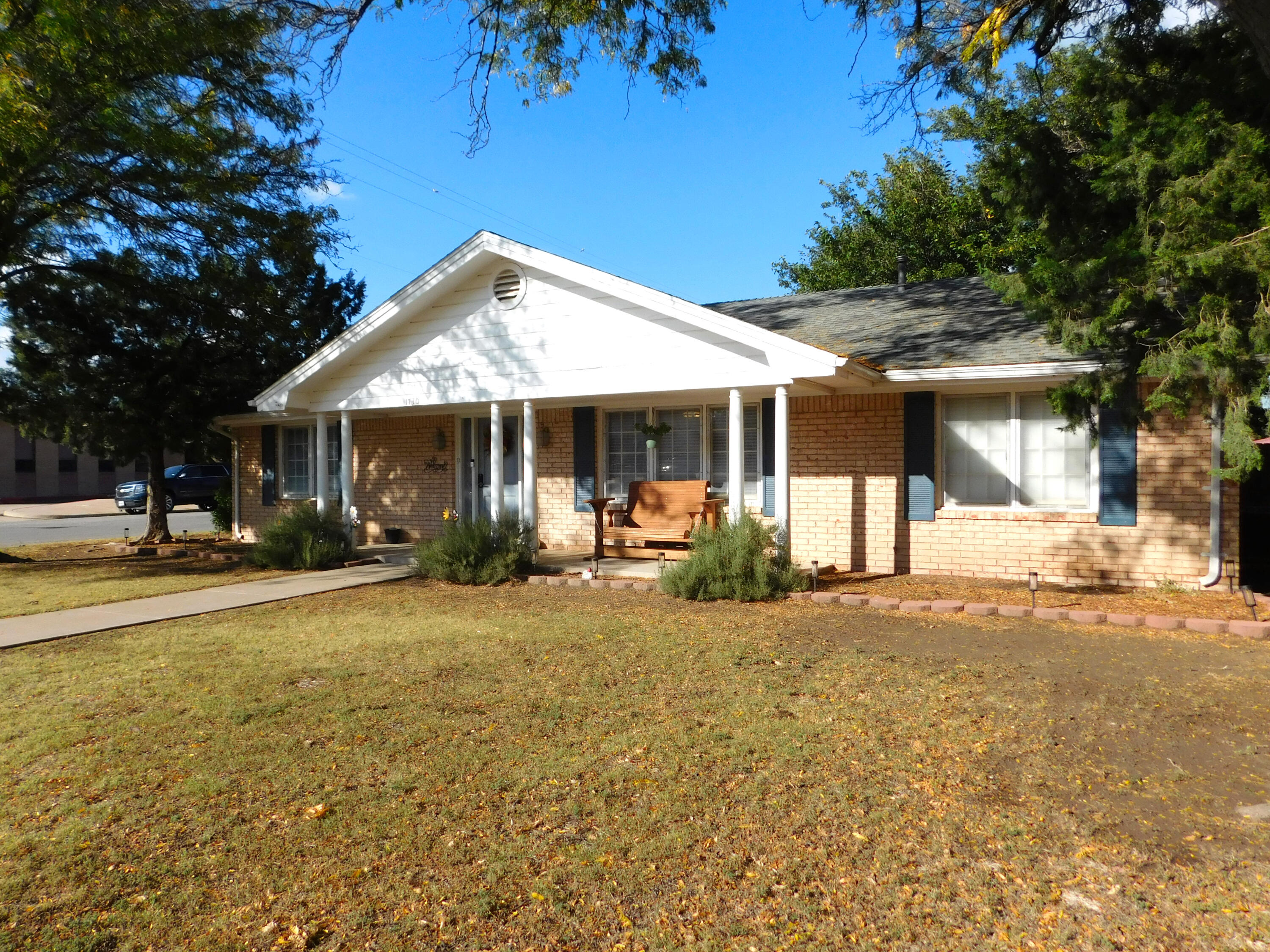 1730 West Ave F Muleshoe, TX 79347 - Photo 6 of 32 a view of a house with a yard and large tree